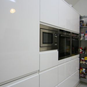 Pullout-storage-in-handleless-gloss-white